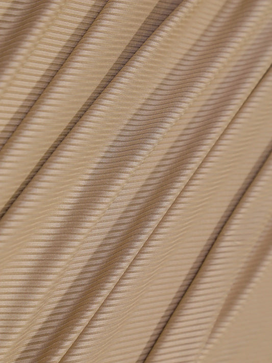 Close-up of beige fabric with a subtle pattern