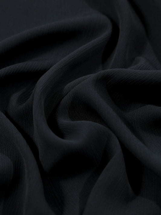 Close-up of dark fabric with folds