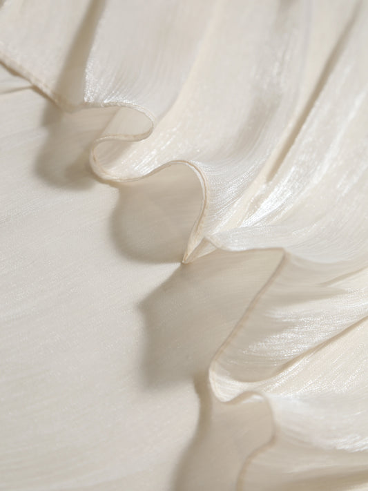 Close-up of white fabric with ruffled texture