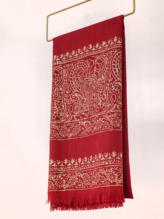 Red scarf with white intricate patterns on a white background