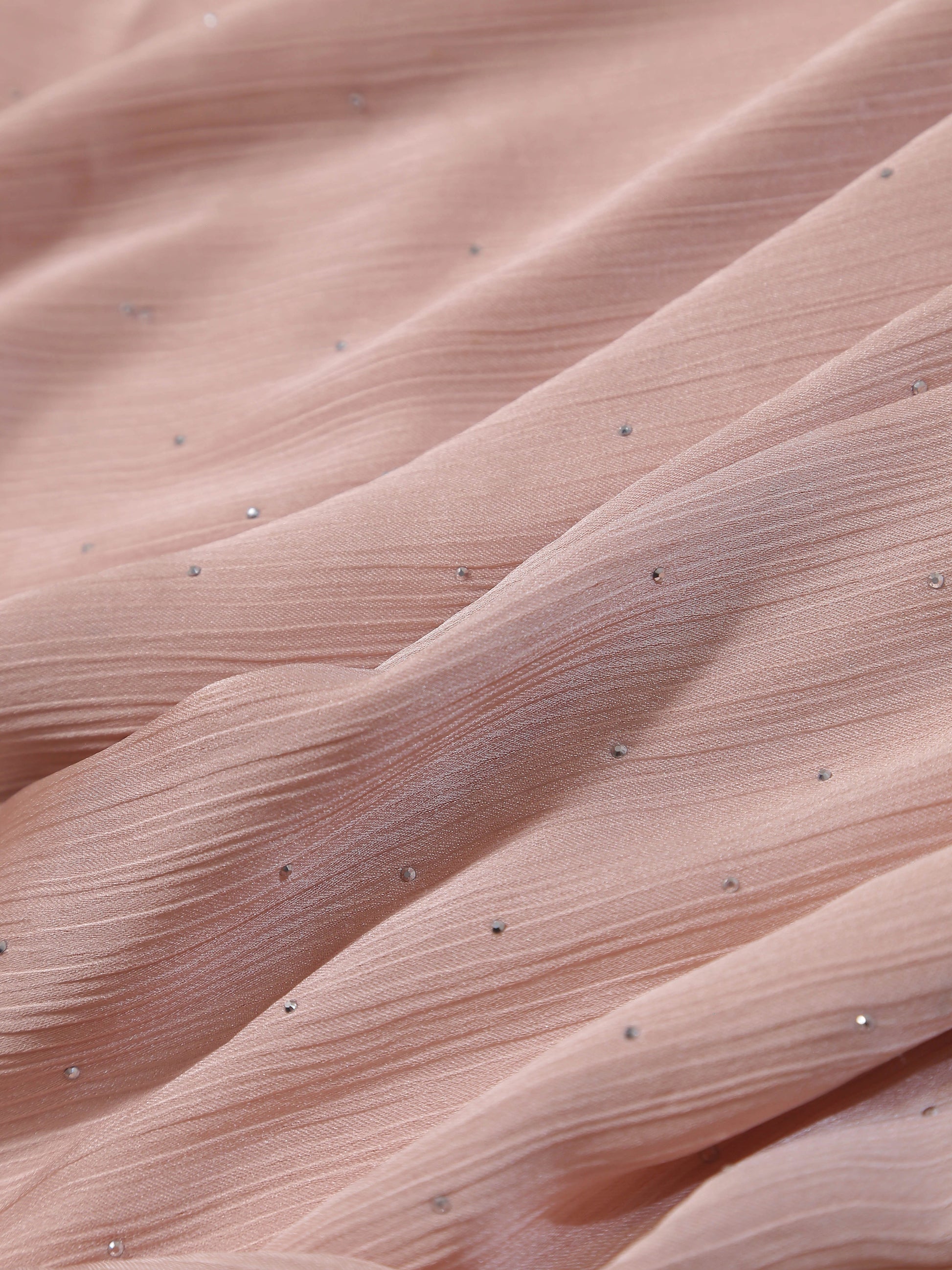 Close-up of soft pink fabric with subtle pleats and small sparkling diamante details from Premium Diamante Silk Hijab - Pink