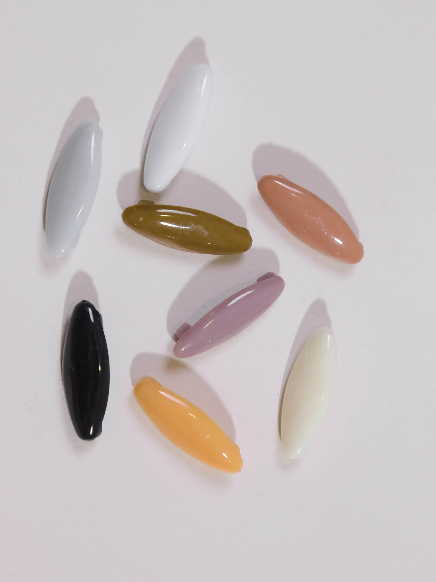 Set of multicolored nail art tips on a white background