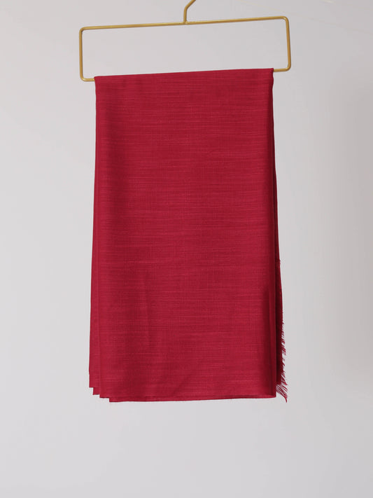 Red scarf with fringes on a white background