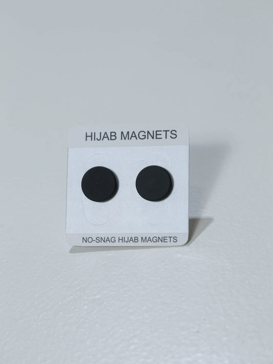 Black hijab magnets on a white card with text on a white background