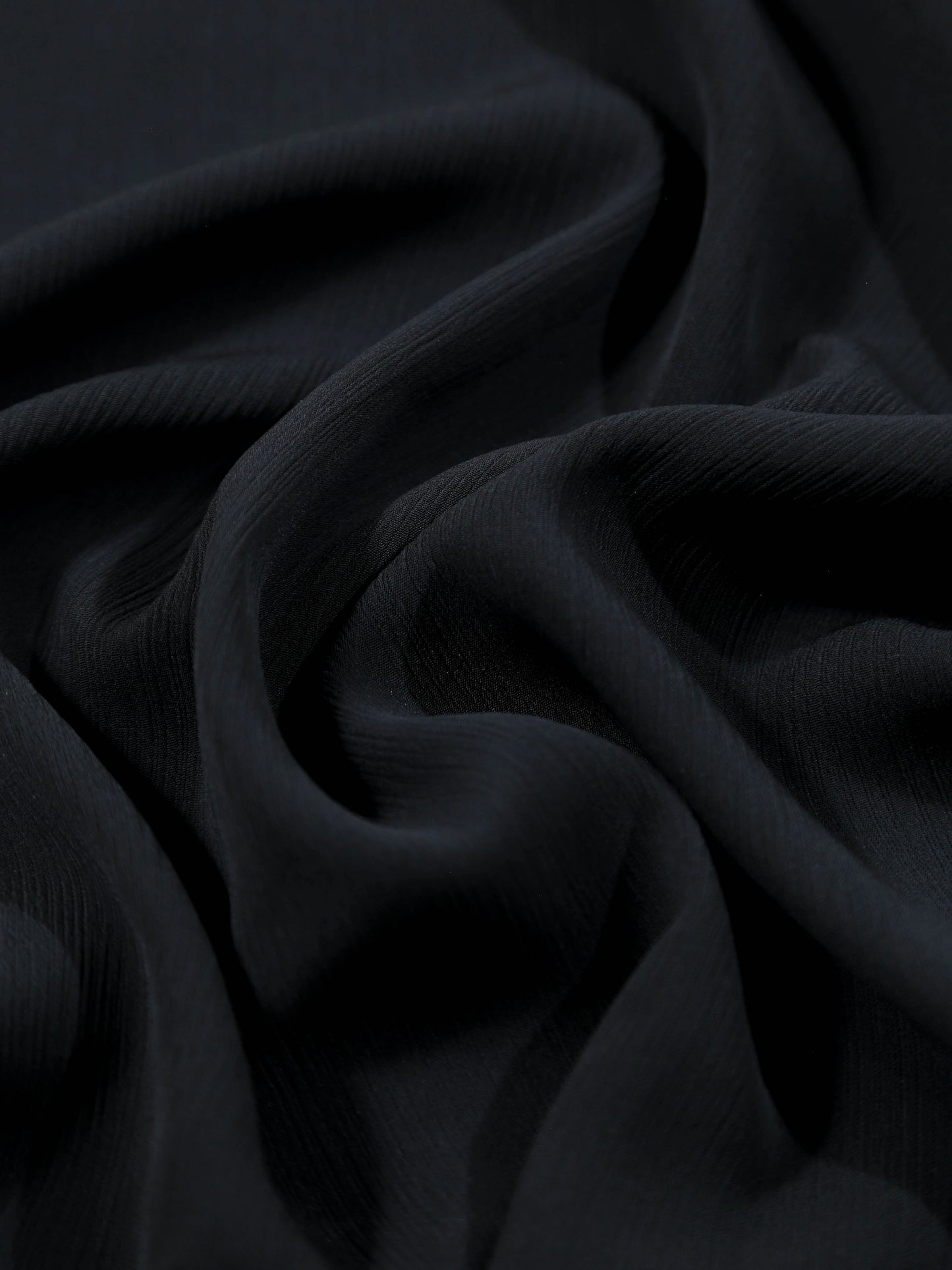Close-up of dark fabric with folds