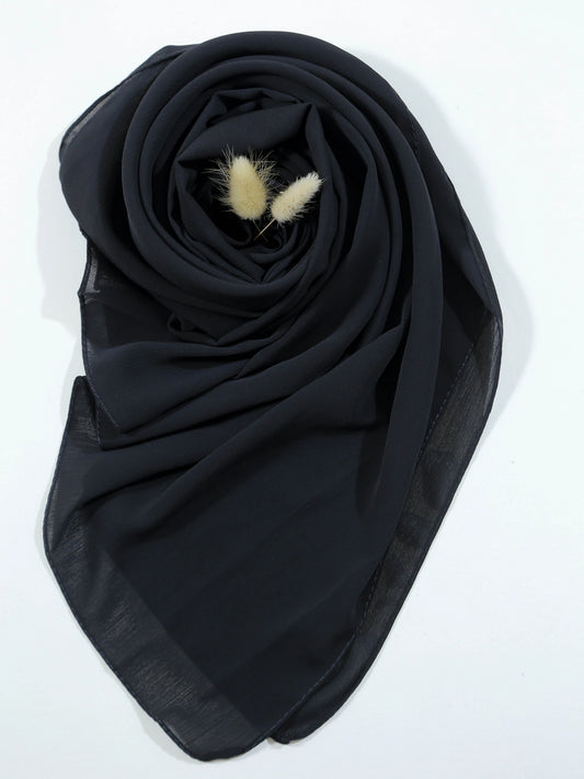 Black scarf with decorative elements on a white background