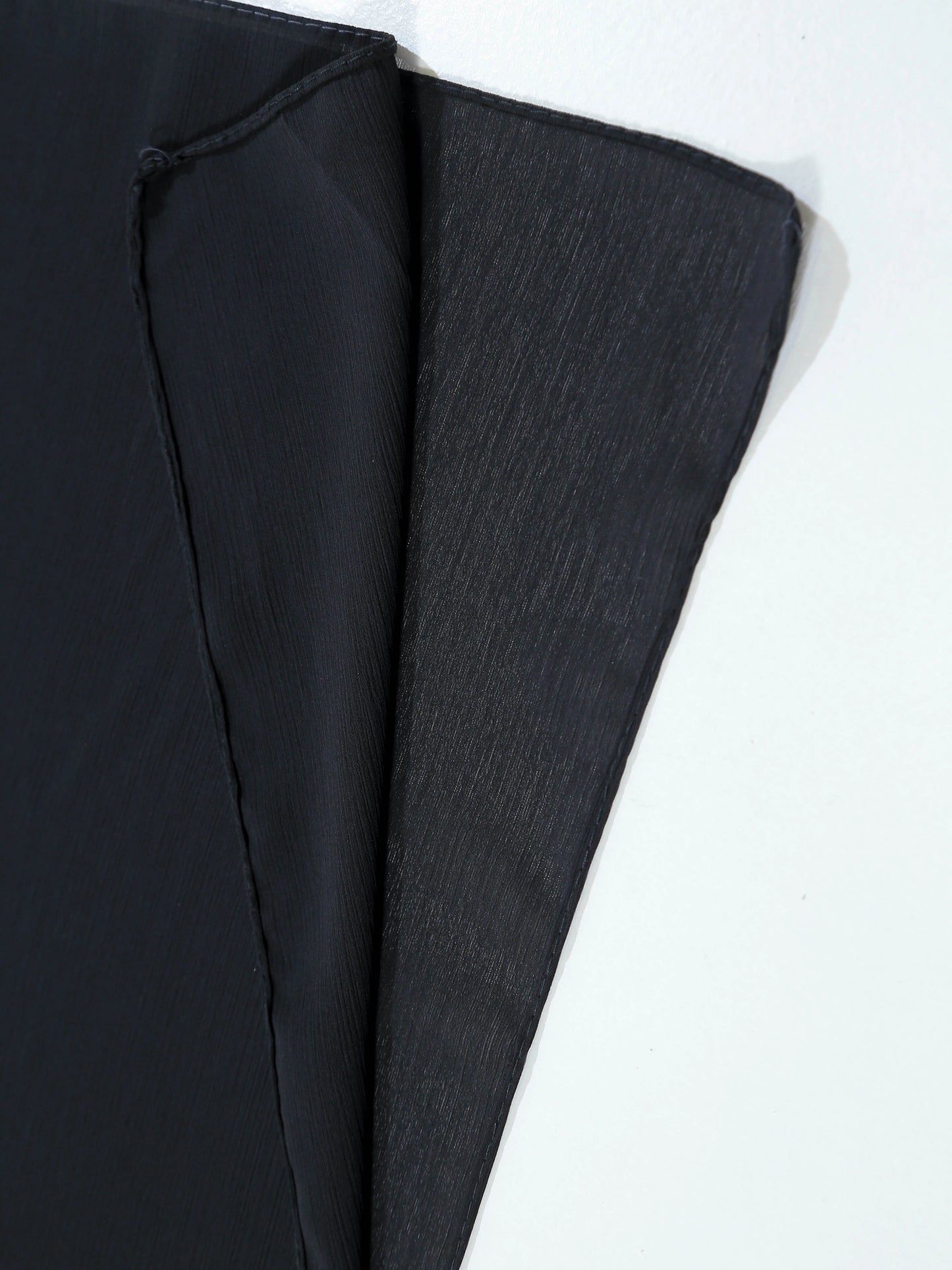 Black fabric on a white background