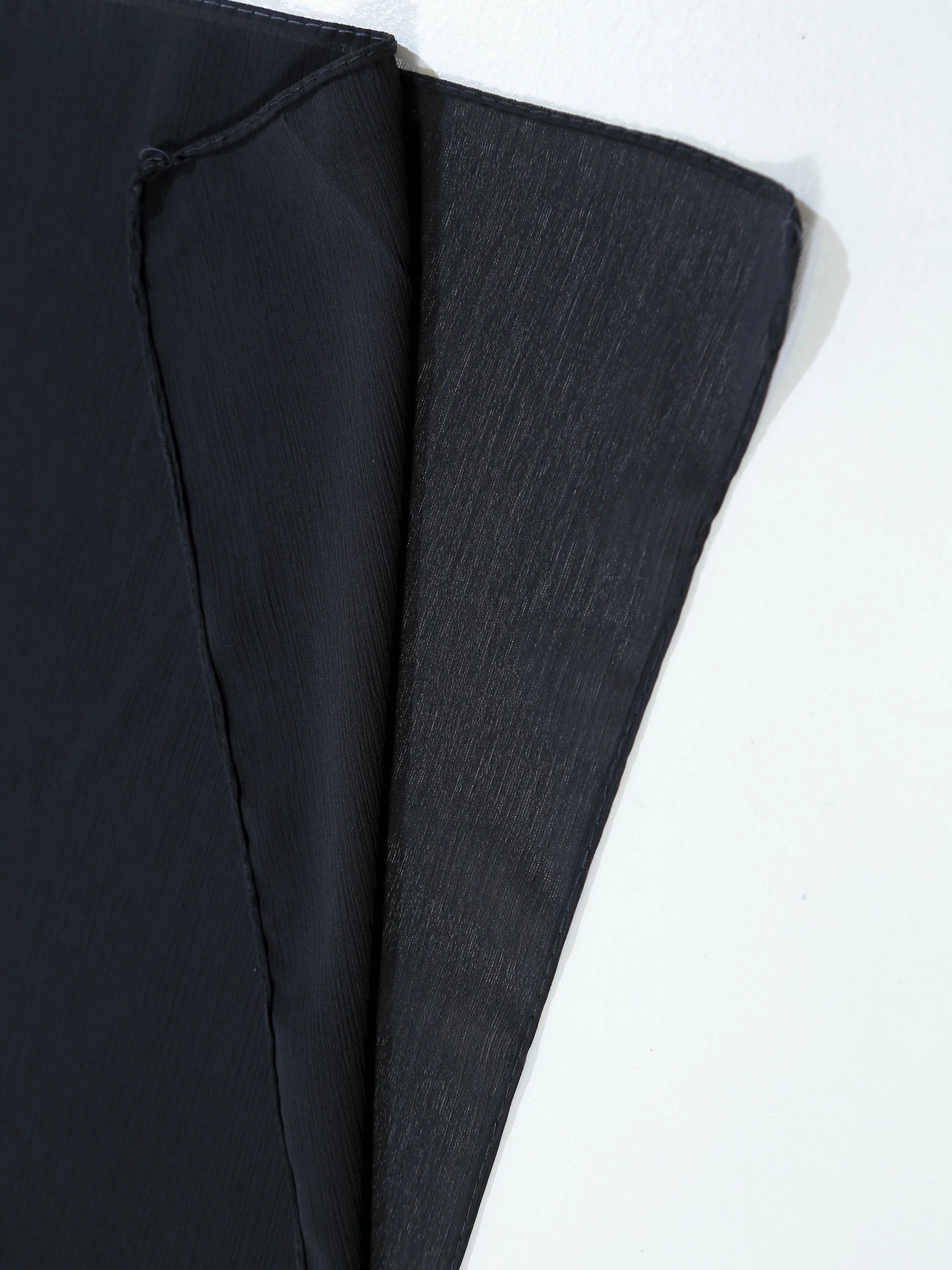 Black fabric on a white background