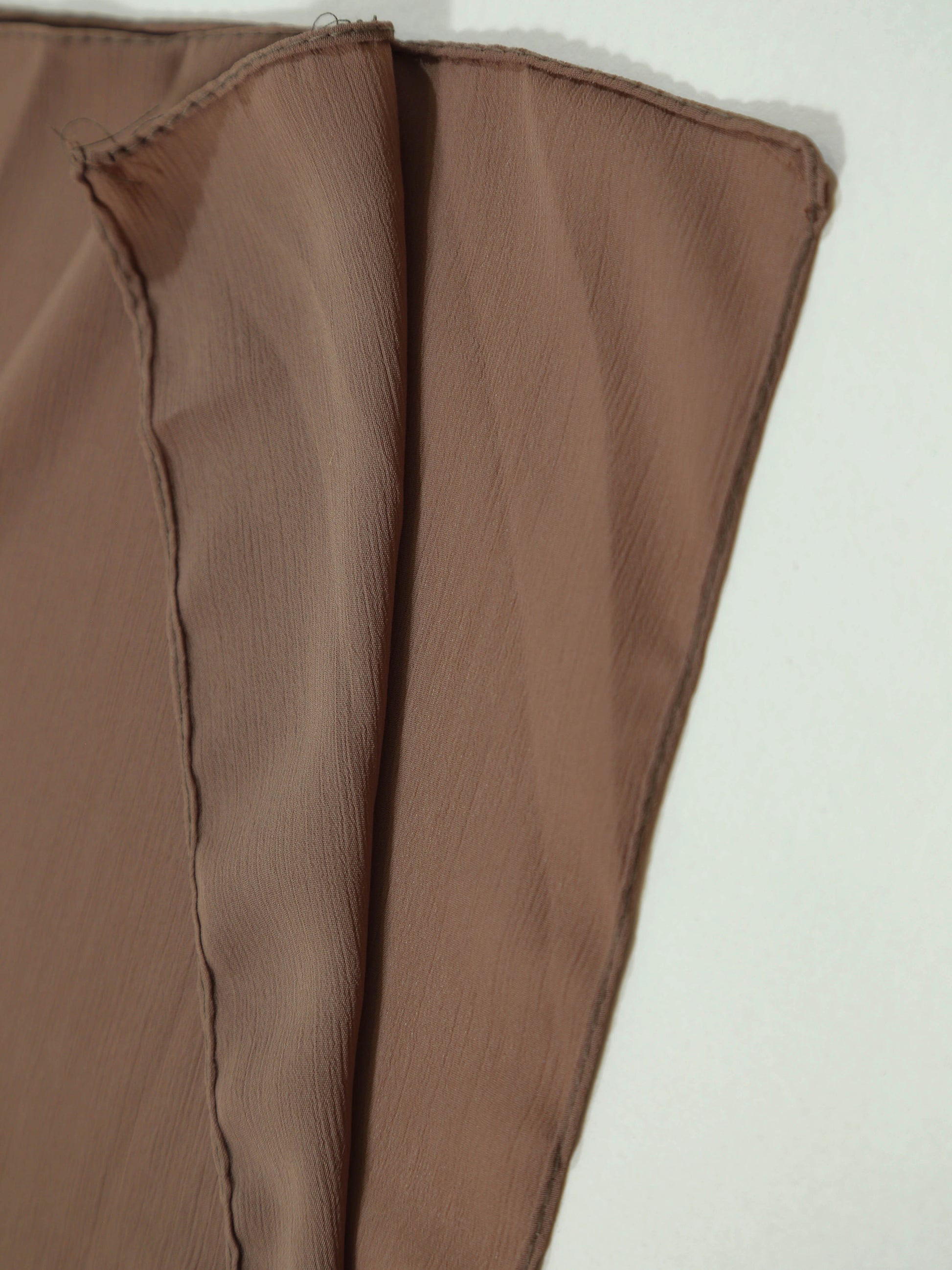 crinkle_georgette_hijab_mocha fabric on a white background