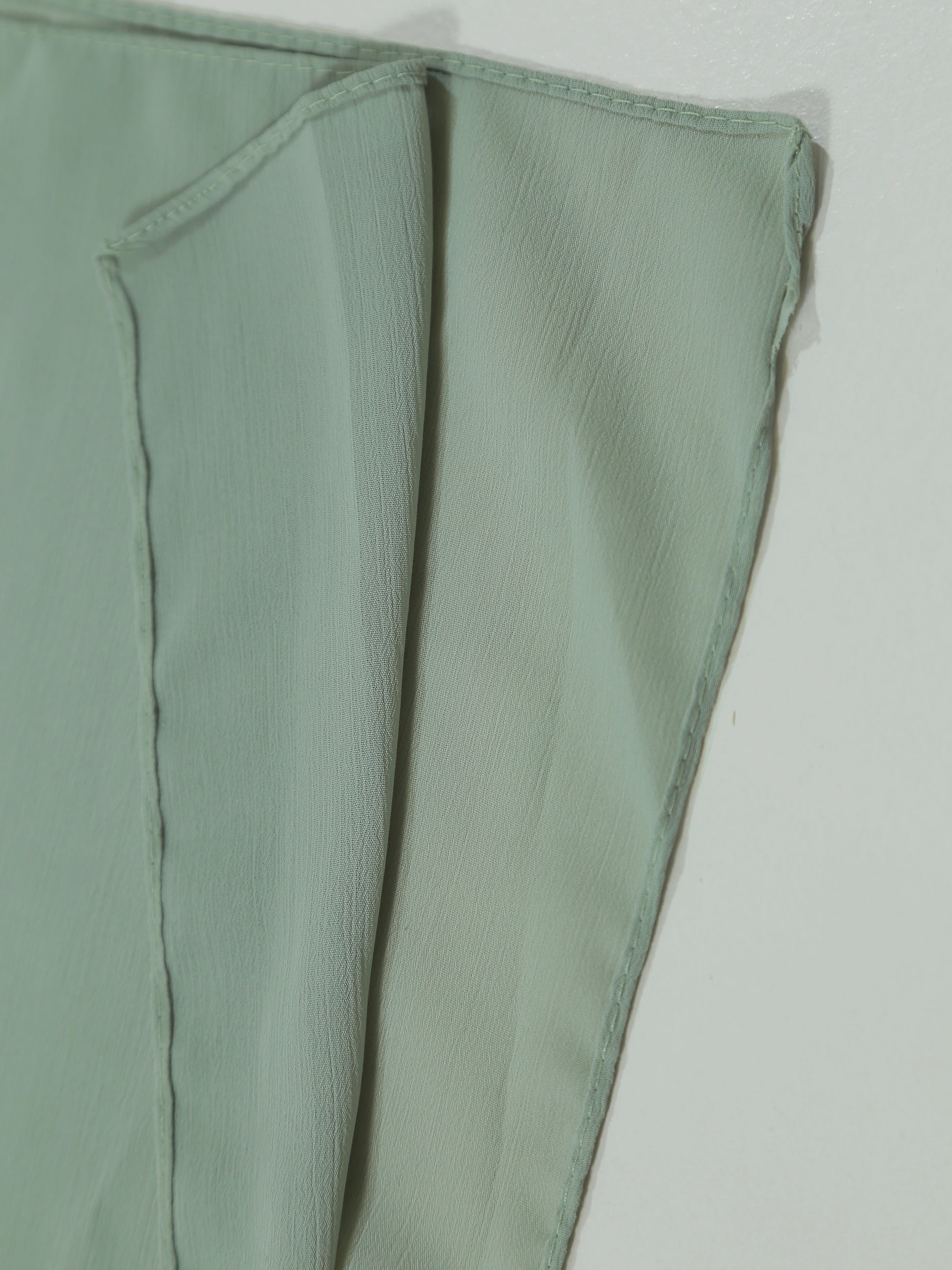 Green fabric on a white background
