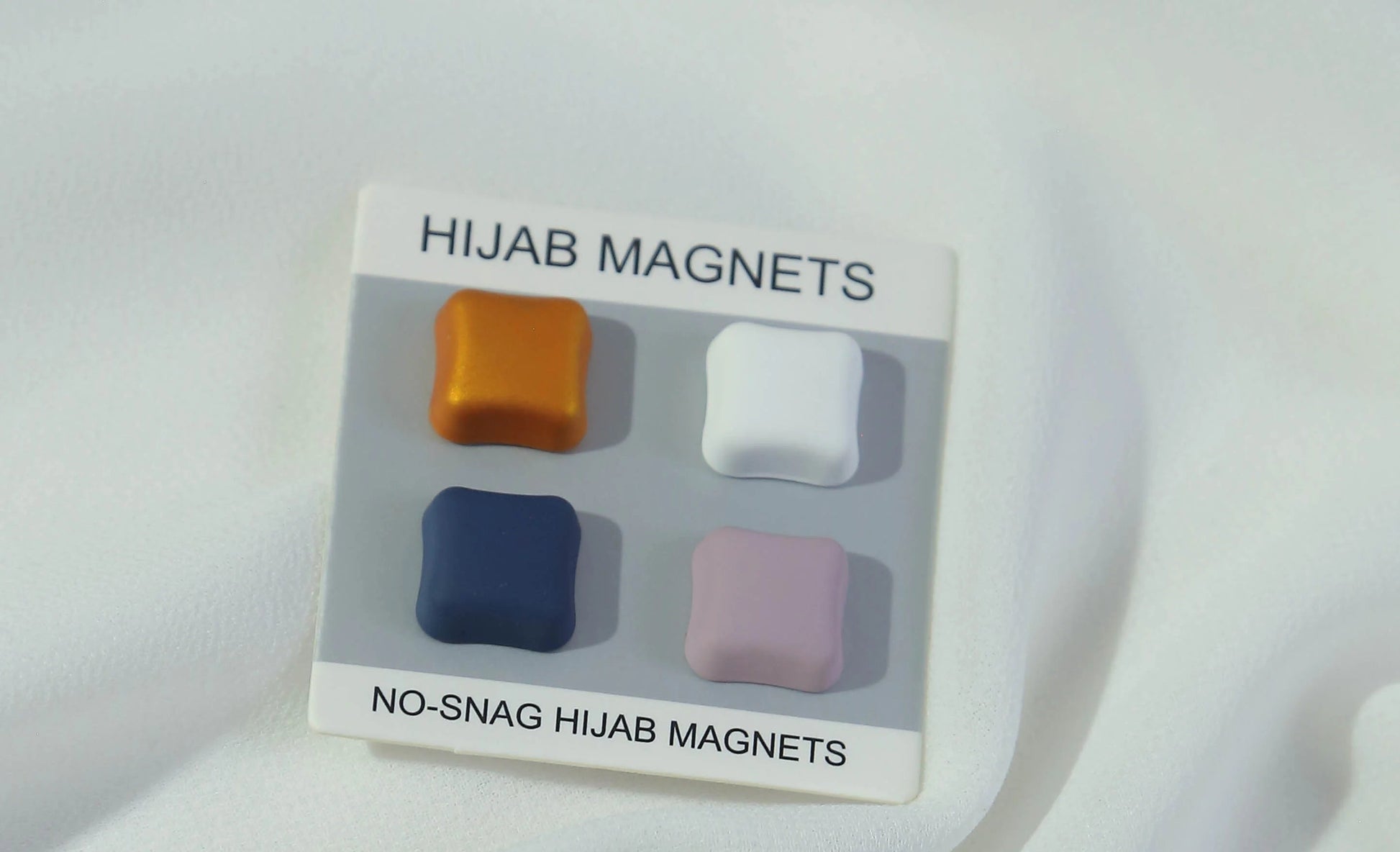 Hijab magnets in packaging on a white background