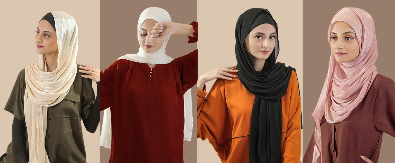 Four women wearing hijabs in different colors against a neutral background