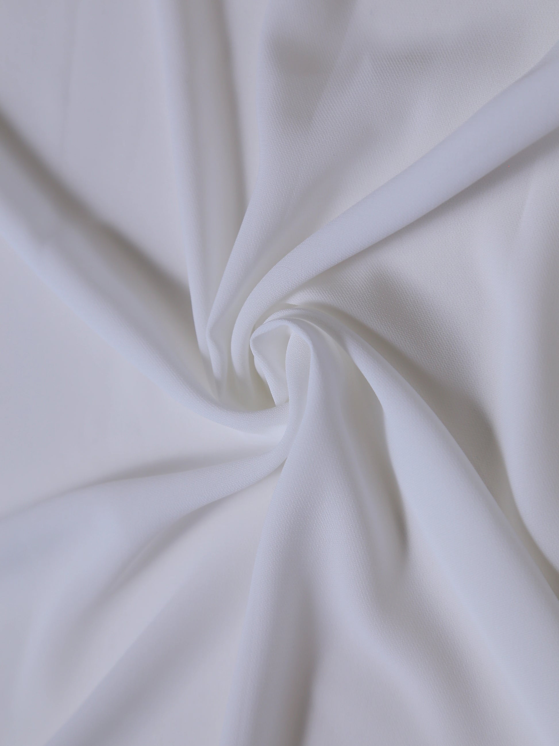 Close-up of white fabric with folds
