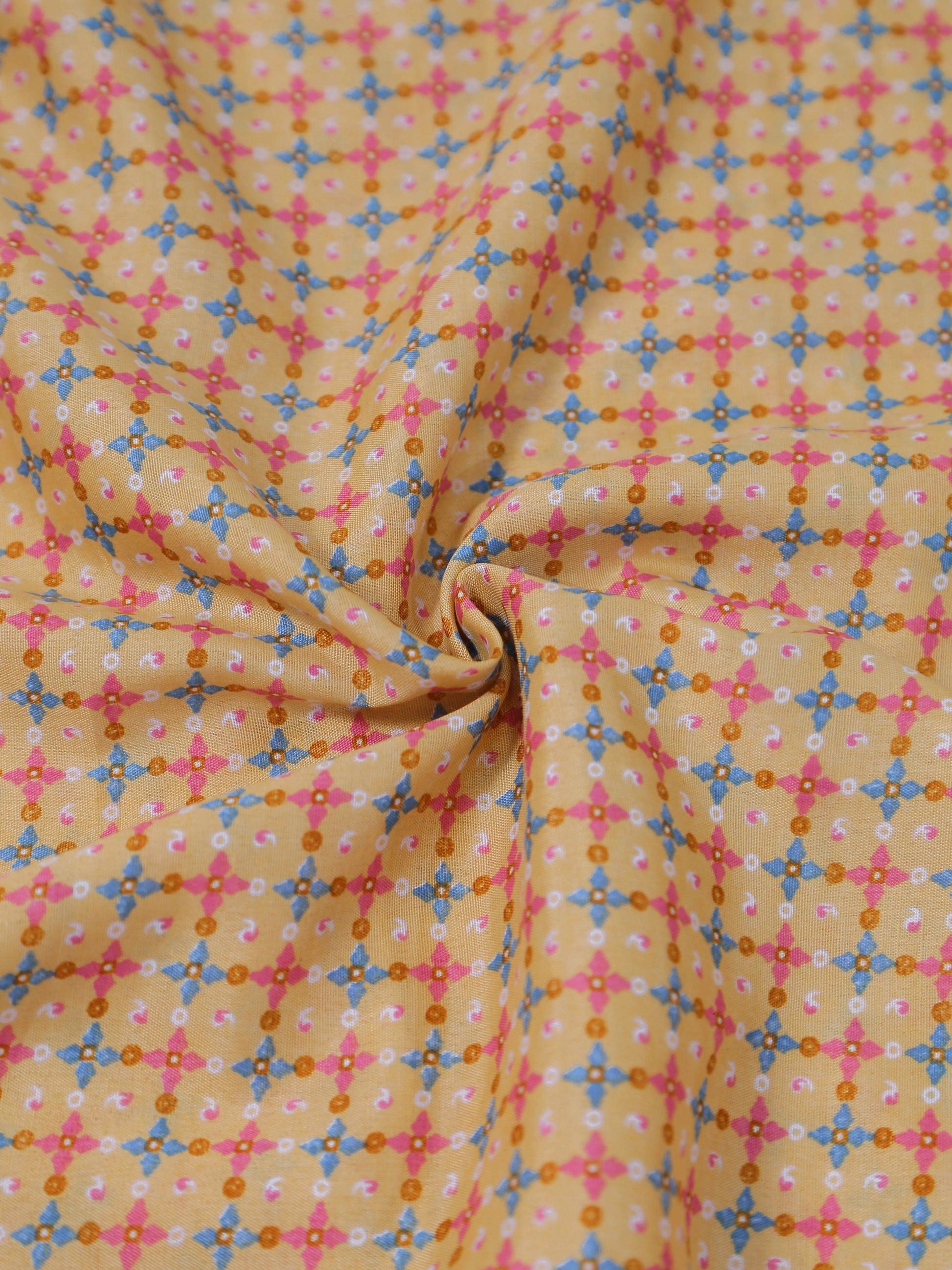 Fabric with a colorful geometric pattern on a yellow background