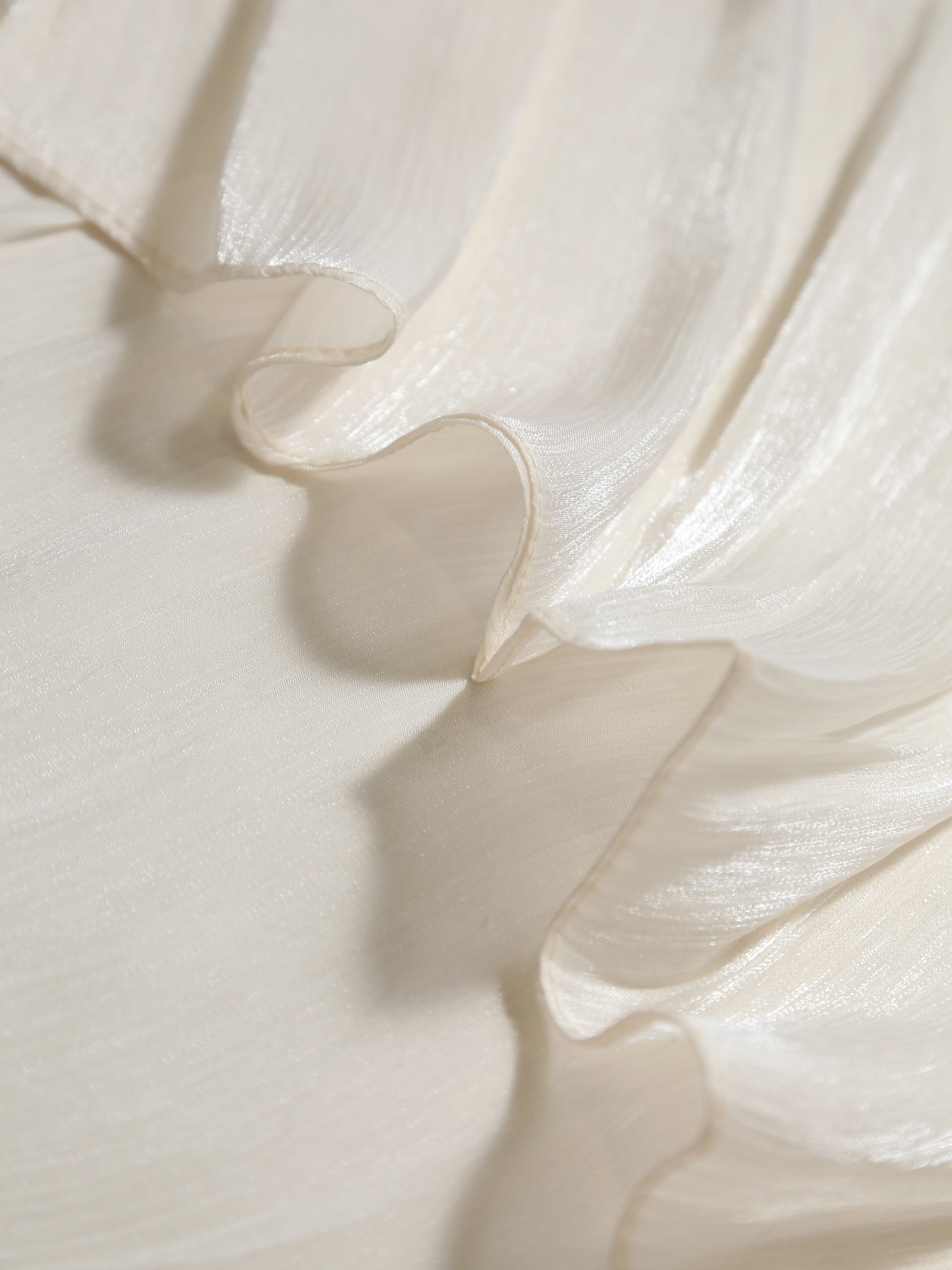 Close-up of white fabric with ruffled texture