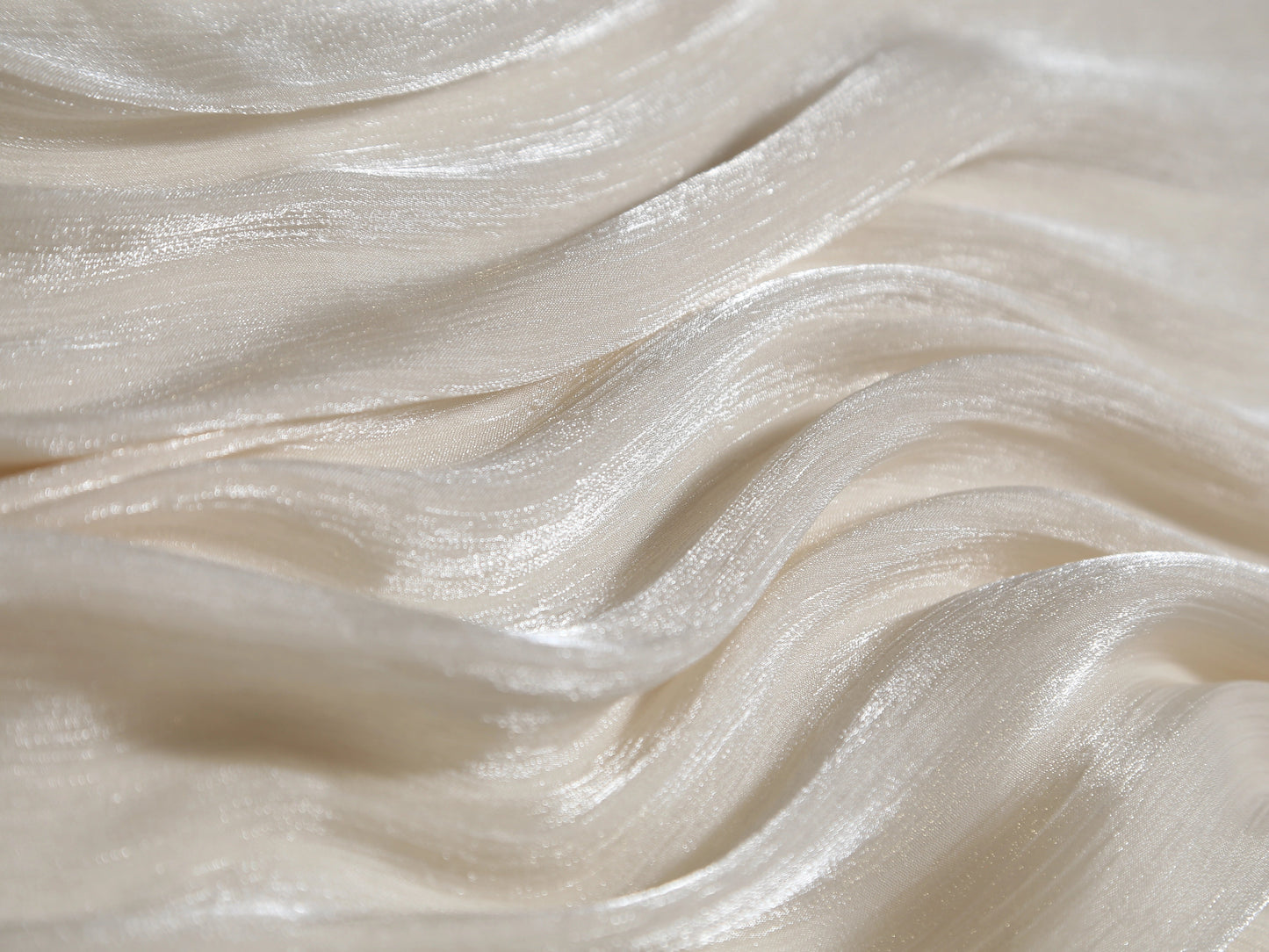 Close-up of smooth, white fabric with wavy texture