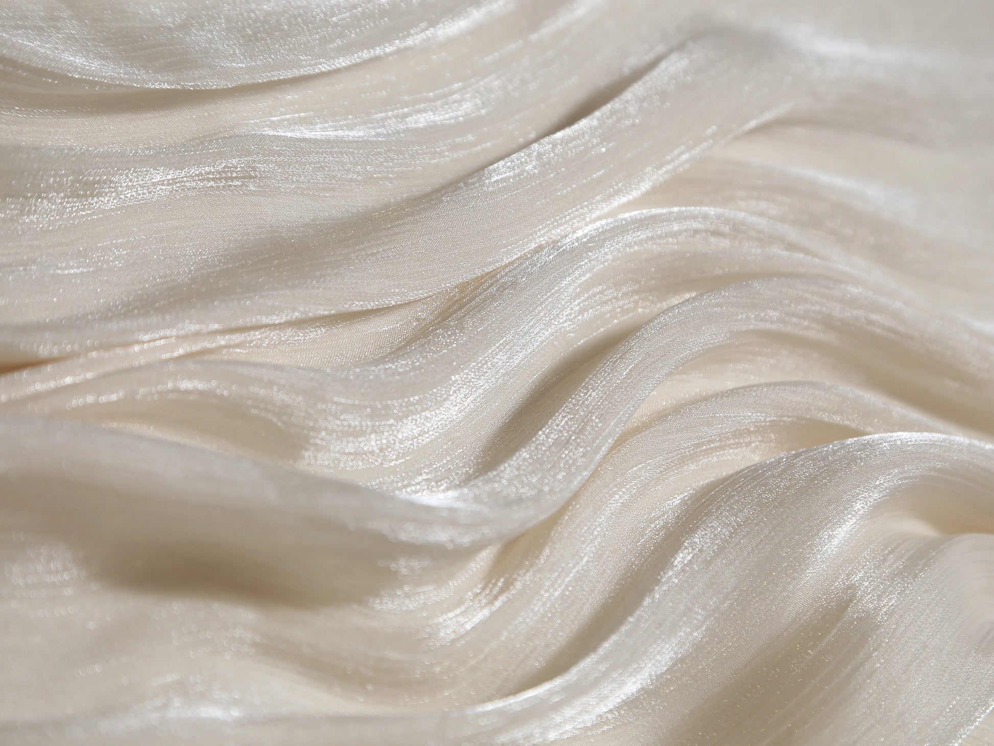 Close-up of smooth, white fabric with wavy texture