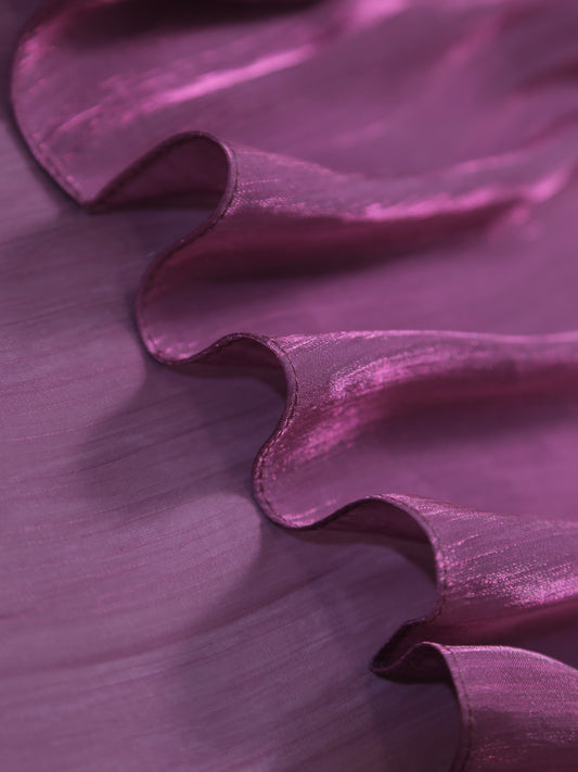 Close-up of purple fabric with a textured surface