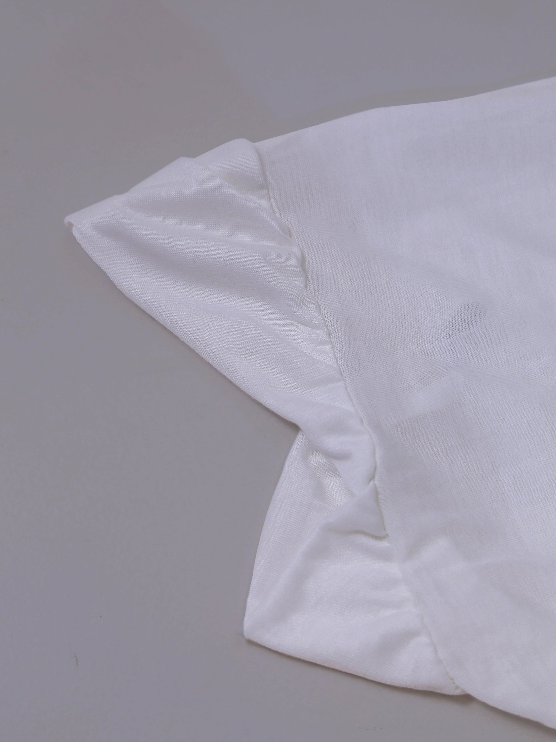 White namaz makna scarfs on a light gray background