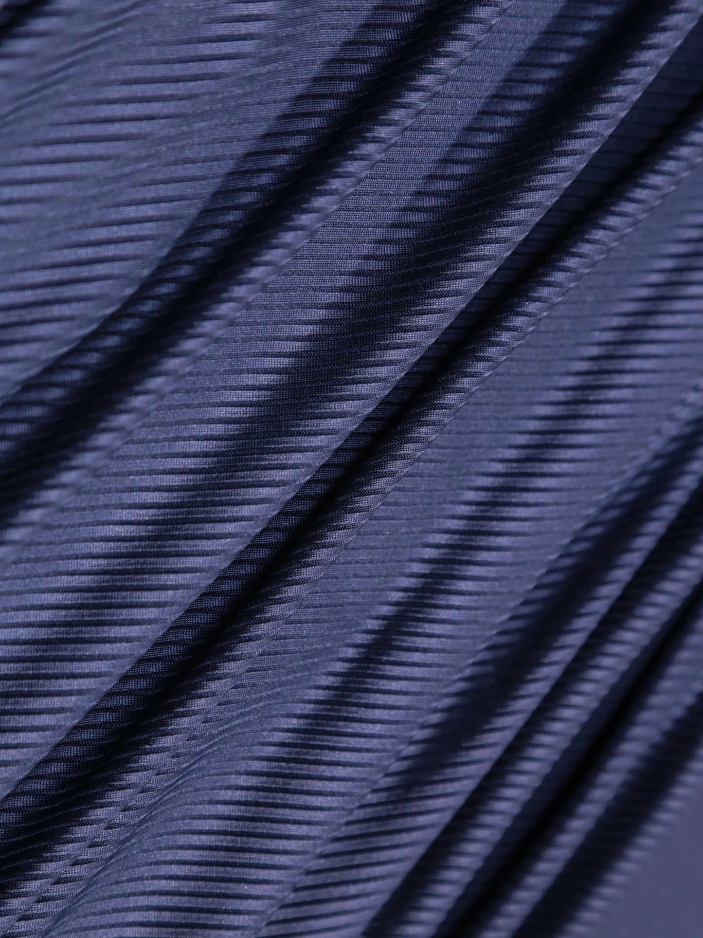 Close-up of blue fabric with a textured pattern